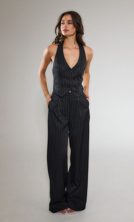 Black Pinstripe Tailored Jumpsuit - 8  Our Pinstripe Jumpsuit is a true power statement. Designed in a premium double lined fabric for a high quality feel the jumpsuit feature a halter neck button-up vest top and  wide leg tailored bottoms for a comfortable relaxed yet sophisticated fit.  How to style:Style with a pair of pointed toe heels or flats for a da Vest Top Styling, Pinstripe Suit Aesthetic, Graduation Suits Women, Pinstripe Vest Women Outfit, Women Suit Prom, Pinstripe Suit Outfit, Hoi An Tailor Clothes, Work Fits Women, How To Wear A Vest Women