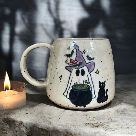 Boo! 🦇🕸️ It’s always halloween season for me ✨���🍂 #londonpotters #ceramics #ceramicart #autumn #autumnvibes #stoneware #wheelthrown #coffee #coffeetime #coffeelover #coffeeshop #mug #coffeemug #tableware #pottery #ceramicstudio #ceramiclove #handmadeceramics #beginnerpotter #halloween #londonartist #handmadepottery #mugs #functionalceramics #handthrown #handcrafted #handmademug #pottersofinstagram #wheelthrowing Autumn Mug Painting Ideas, Halloween Mugs Diy, Autumn Mug Painting, Halloween Ceramic Painting, Ceramic Painting Halloween, Halloween Mug Painting Ideas, Fall Mug Painting Ideas, Halloween Pottery Painting Ideas, Pottery Painting Halloween