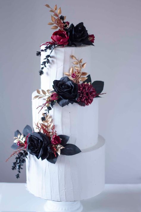 Floral cake topper in black, gold and burgundy colors ideal for black weddings, Halloween or any other event with this color palette. The cake in the image measures 45 cm high by 25 centimeters wide. The flowers are made of fabric and plastic and inedible. You can buy each style separately or purchase the full set that includes the 3 styles that appear in the image. The colors of the flowers can be substituted if you wish, just contact us before placing your order. The delivery times are: Peninsular Spain: 1 to 3 days. Spain Islands: 5 to 10 days. Europe: Between 5 and 10 business days. America: Between 10 and 20 business days. If you need your order more urgently, you can purchase our store tab called expedited shipping along with your order. I leave you a link below. https://www.etsy.com Dark Themed Wedding Cake, Wedding Cake With Dark Flowers, Goth Wedding Cake Victorian Gothic, Black Burgundy And Gold Wedding Cake, Tim Burton Wedding Cake, Dark Floral Wedding Cake, Dark Red Wedding Cake, Black And Burgundy Wedding Cake, Gothic Wedding Cake Simple