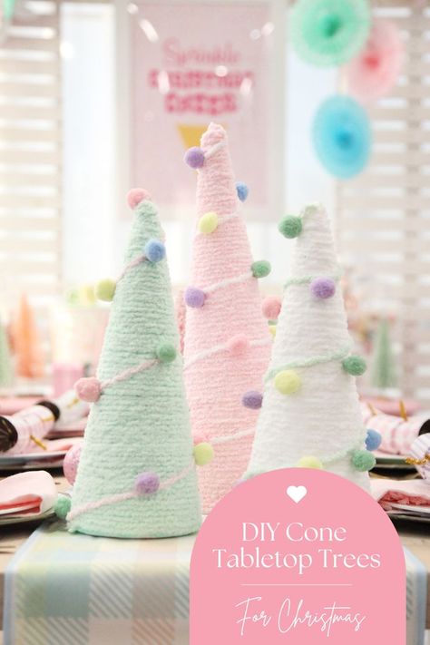 Get ready to add a pop of color to your holiday decor with our DIY cone table top Christmas trees tutorial! Learn how to create adorable trees using polystyrene cones adorned with pom poms and wool. Perfect for pastel Christmas decorating themes or fun and colorful holiday setups. Let your creativity shine and bring a whimsical touch to your festive tabletops! Christmas Decorating Themes, Table Top Christmas Trees, Trees Tutorial, Diy Cone, Pastel Christmas Decor, Colorful Christmas Decorations, Whimsical Christmas Decor, Christmas Party Table, Gingerbread Christmas Tree