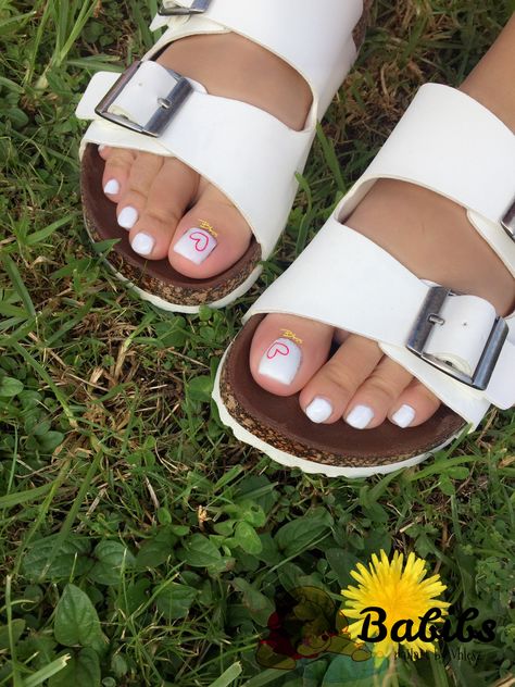 White and heart nail art pedicure #pedicure #toes #toenailart #nailart #simple #white #heart #love White Pedicure With Flower Design, Pedicure Heart Designs, Pink And White Pedicure Toenails, White And Pink Pedicure, Toe Nails White Design, Heart Pedicure Designs, White Pedicure With Design, Pedicure Designs Toenails White, Pedicure White Toenails