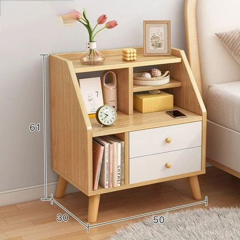 Bedside table with compartments and two drawers Ksh 6,000 ▫️Storage Compartments: For decorative items,small plant, lamp, alarm clock, and other bedside essentials. ▫️Sections for organizing books or small gadgets. ▫️A shelf beneath the partitioned storage for easy access to frequently used items like a tablet or magazines. ▫️Two spacious drawers at the bottom, offering concealed storage for personal items and ensuring a clutter-free appearance. ☎️0719229187 📌Location:Superior Arcade along Ac... Corner Shelves Design, Shelves Design Ideas, Organizing Books, Plant Lamp, Light Colored Furniture, Shelves Design, Kb Homes, Small Bedside Table, White Bedside Table