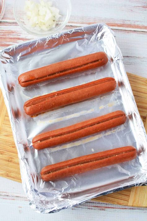 Sheet pan hot dogs in the oven frozen or fresh. Easy way to make lunch in bulk quickly! Roasted plump Oscar Mayer or Hebrew National wieners. Cook Hot Dogs In Oven, How To Cook Hotdogs In The Oven, Oven Hot Dogs Baking, Roasted Hot Dogs In The Oven, Christmas Hot Dogs For Kids, Oven Roasted Hot Dogs, Cooking Hot Dogs In Oven, How Long To Bake Hot Dogs In The Oven, Hot Dog In Oven