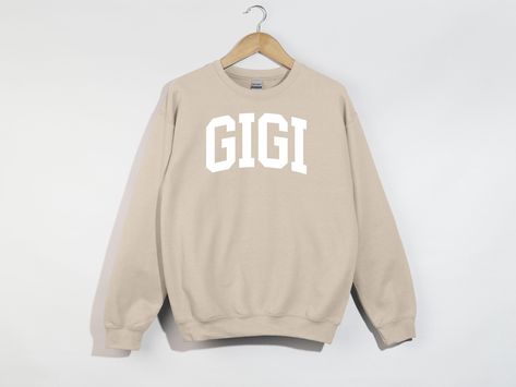 Gigi Sweatshirt, Gigi Hoodie, Gigi Shirt, Gigi Birthday Gift For Grandma, Gigi Gifts, Gigi Crewneck, Best Gigi Ever, Mothers Day Gift. PRODUCTION TIME: 1-3 days (Typically within 2 days) SHIPPING TIME: 2-5 days (Typically 3 days) PRODUCT DESCRIPTION: The Gildan UNISEX Sweatshirt (18000) is crafted from high-quality materials. The Gildan Heavy Blend garment offers an impeccable fit and a plush, comfortable feel.  CARE INSTRUCTIONS: - Machine wash: warm (maximum 40C or 105F) - Use non-chlorine ble Gigi Birthday, Gigi Gifts, Birthday Gift For Grandma, Gigi Gift, Gigi Shirts, Birthday Gifts For Grandma, Gift For Grandma, Care About You, Grandma Gifts