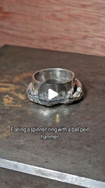 Richard Chown on Instagram: "This is one of the super chunky wrought spinner rings being flared to hold the spinning section in place. The rounded end of a ball pein is rested in the side of the ring and the flat side is hit with a mallet to force the edge of the band out.
#spinnerring #silversmithing #hammering" Silversmith Rings, Chunky Silver Rings, Ring Inspiration, Spinning Ring, Spinning Rings, Silver Spinner Rings, Chunky Rings, Super Chunky, Spinner Ring