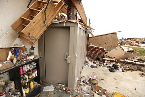 This above ground safe room at a destroyed home on SW 147th St. in Moore, OK, is still standing after taking the impact of May 20th's EF5 tornado. In the background is the remains of Briarwood Elementary School. Thursday, May 30, 2013,  Photo by Paul Hellstern, The Oklahoman Above Ground Tornado Shelter, Storm Shelter Ideas, Ef5 Tornado, Above Ground Storm Shelters, Tornado Safe Room, Storm Cellar, Tornado Season, Oklahoma Tornado, Storm Shelters