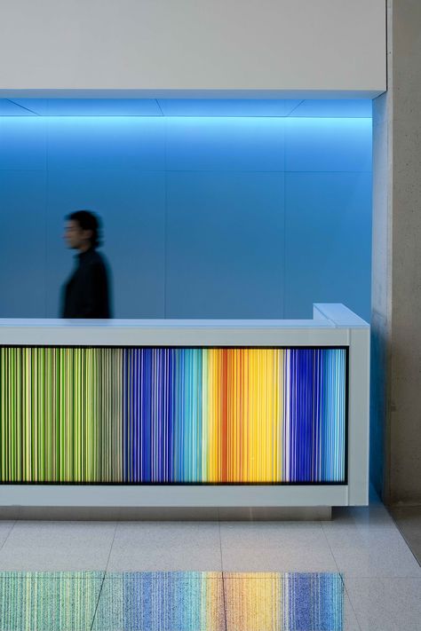 Colorful Reception Area, Colorful Reception Desk, Futuristic Reception Desk, Retro Reception Desk, Coastal Hardware, Reception Desk Lighting, Lobby Desks, Atrium Design, Reception Desk Design