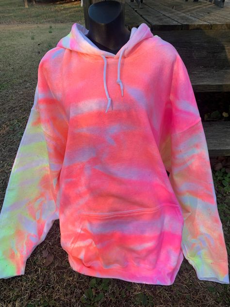 I accidentally made this hoodie and now I'm quite happy that I did!  The orange and pink goes together so well in this tie dye hoodie. Now I'm going to have to make me one! LOL I'm happy to offer this to customers and I hope you guys like this neon style hoodie as much I do.  Each hoodie is 50% cotton and 50% polyester. They are soft and comfy. I use mens hoodies because there is a little more room to move and are more comfortable.  I normally use Gildan or Hanes brand. So please order your size accordingly.  WASHING INSTRUCTIONS: turn your tie dye hoodie inside out before washing in cold water. Dry as you normally would or hang to dry.  Thank you for stopping by my shop. Feel free to message me with any questions you may have. Tie Dye Smiley Face, Neon Tie Dye, Sweatshirt Tie Dye, Bellybutton Piercings, Women Long Cardigan, Tie Dye Fashion, Diy Tops, Future Wardrobe, Pastel Tie Dye