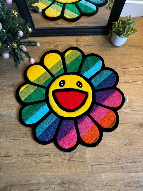 Handmade Rainbow Flower Face Tufted Rug. FREE UK SHIPPING! Material - 100% Acrylic wool Easy to clean - Hoover as needed Premium tufted for a soft fluffy feel Durable for floor and wall use Non-slip backing cloth 'The Rug Buds' Tag For international orders delivery will vary between £15-30 so please bare that in mind! As stated in Etsy's policies, import taxes are the responsibility of the international buyer, these costs will not be covered by us.  We are UK based, feel free to message whenever you like!  Additional sizing etc available on request, just send us a message! Flower Rug Tufting, Tuft Rug Design Ideas, Tufting Rugs Ideas, Tuft Rug, Rainbow House, Flower Face, Flower Rug, Tufted Rugs, Rainbow Flower