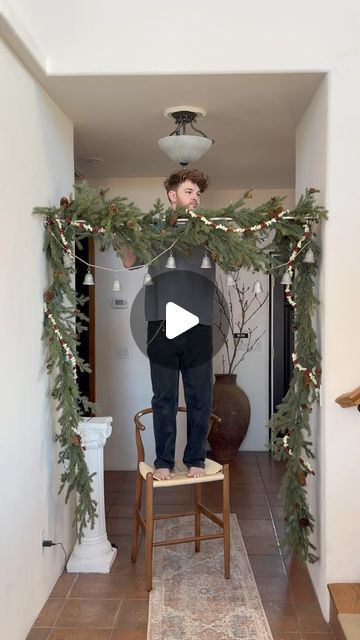 48K likes, 331 comments - lonefoxhome on November 25, 2023: "After @thekwendyhome shared this garland hanging hack, I HAD TO GIVE IT A GO at my parents house!..." Hallway Holiday Decorating, Garland Around Light Fixture, How To Make A Cedar Garland, Garland On Ceiling Beams, Sticking Hanging Ideas No Fireplace, Garland Over Window Christmas, Ways To Hang Garland, Christmas Entry Decorations, Decorate Hanging Light Fixture Christmas