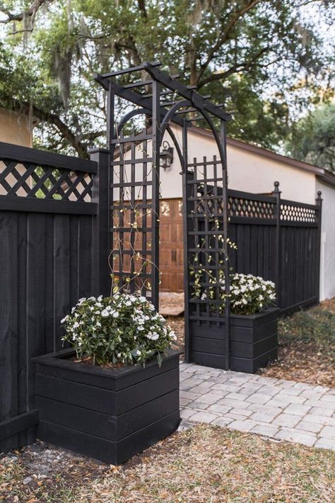 Black Vinyl Fence Front Yard, Black Wood Fence Backyards, Wood Fence With Metal Gate, Wood Fence Decorations, Diy Trellis Archway, Fenced In Patio, Black Wood Fence, Natural Paths, Gardening 2023