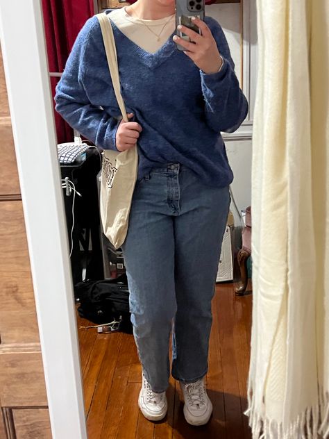 A person stands in front of a mirror wearing a blue sweater over a white shirt. The person also has a white tote bag and is wearing white shoes. V Neck Sweater With Shirt Underneath, Blue V Neck Sweater Outfit, Blue Longsleeves Outfit, Vneck Sweater Outfit, V Neck Sweater Outfit, Neck Sweater Outfit, Fair Outfits, Gray Whale, College Outfit