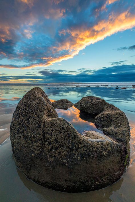 I photographed this unique reflection on Moeraki Boulders Beach on the South Island of New Zealand. The rainwater trapped in the boulder reflected the sky, and the ocean reflected the sky as well but ... Unreal Nature, Nz Scenery, Unreal Places, New Zealand Photography, Moeraki Boulders, Boulders Beach, Forest Dragon, New Zealand Beach, Boulder Beach