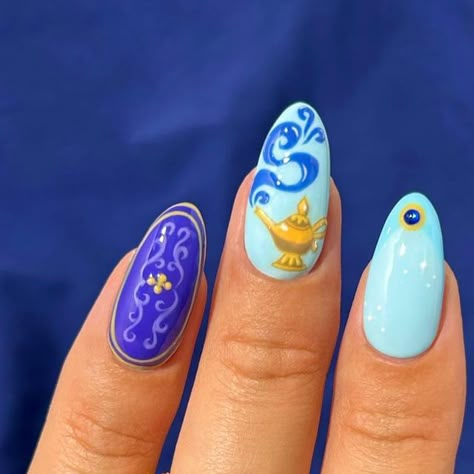 the nailologist🍒🌸🦋🌈✨ on Instagram: "Disney princess nails: Aladdin edition 🩵🧞‍♂️👑 Rings are from @monicavinader and you can use code NAILOLOGIST20 for 20% off💙 #nails #nailinspo #nailart #princessnails #disneynails #halloweennails" Aladdin Nails Acrylic, Jasmine Nail Art, Disney Princess Nails Aesthetic, Elemental Nails Disney, Disney Rapunzel Nails, Aladdin Nail Art, Disney Inspired Nails Princesses, Disney Princess Themed Nails, Inside Out Nails Disney