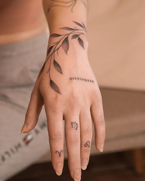 sabyminaart - fineline tattoo on Instagram: “Today I had the honour to make a tattoo concept on Lisas hand 😱❤️ with a single needle lettering, some leaves and zodiac signs on her…” Mini Tattoos For Hand, Sideways Rose Tattoo, Snake And Rose Forearm Tattoo, Creator Tattoo, Wrist Hand Tattoo, Simplistic Tattoo, Full Sleeve Women, Tattoo Dainty, Wrap Around Wrist Tattoos