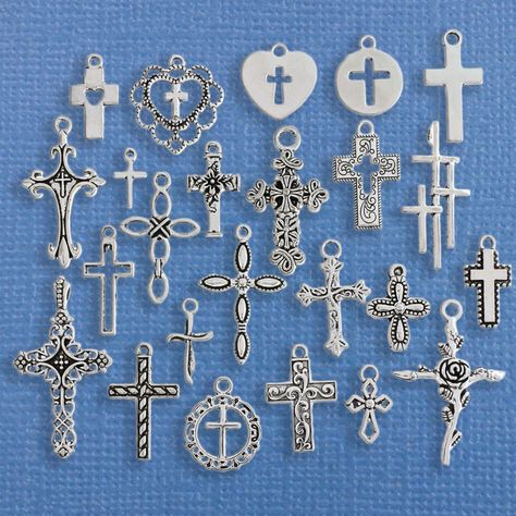 Cross themed collection of antique silver tone charms, in a zinc alloy metal. Perfect for bracelets, pendants, earrings, zipper pulls, bookmarks and key chains! Measurements: 10mm - 30mm Hole Size: 2mm You will receive 1 set of 24 charms. PLEASE NOTE: From time to time I may need to substitute one of the charms for another of equal or greater value... all keeping with the theme of the collection. Need more? Just send us a message through the contact us form, instant chat, or at mailto:info@bohem Cybergoth Anime, Crimp Bead Covers, Rosary Jewelry, Jewelry Making Business, Bead Collection, Weave Shop, Jewelry Cross, Charm Collection, Beading Tools