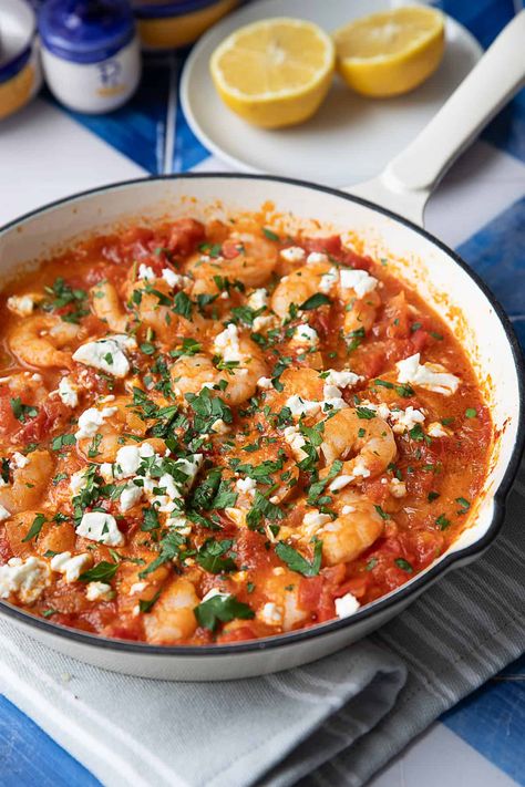 Shrimp Saganaki with feta and tomatoes is a quick and flavorful Greek dish that's perfect for a quick lunch or dinner. With shrimp, tangy feta, and a rich tomato sauce, it's both satisfying and easy to prepare. A simple one-pan recipe for those busy days where you're craving something flavorful. Shrimp Tomato Feta, Shrimp Feta Recipes, Shrimp Saganaki Greek, Greek Shrimp With Tomatoes And Feta, Shrimp With Feta And Tomatoes, Shrimp Saganaki With Feta, Shrimp And Feta Recipes, Greek Shrimp With Orzo And Feta, Shrimp Tomato Recipes