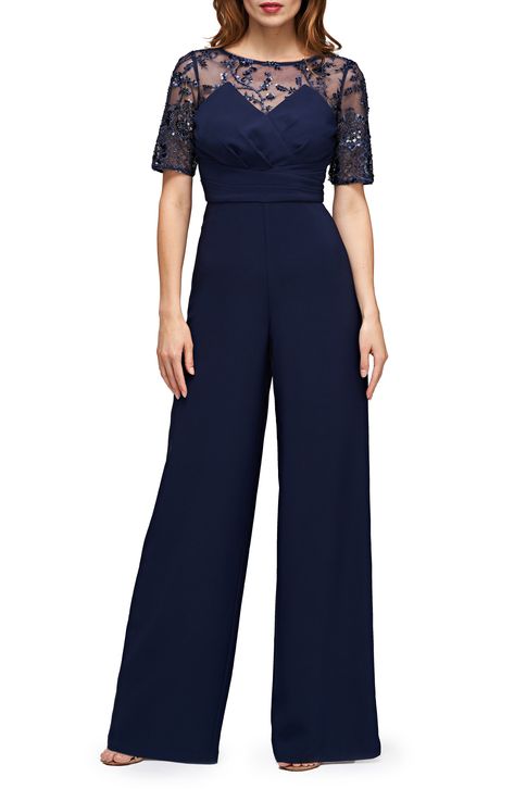 Get to the festivities faster in a one-and-done jumpsuit detailed with dazzling sequins and finished with widened legs. 60 1/2" length Hidden back-zip closure Jewel neck Long sleeves Lined 100% polyester Dry clean Imported Formal Jumpsuits For Women Wedding, Prom Romper, Dressy Jumpsuit Wedding, Bride Jumpsuit, Palazzo Jumpsuit, Black Tie Wedding Guests, Wedding Jumpsuit, Embroidered Border, Bateau Neck