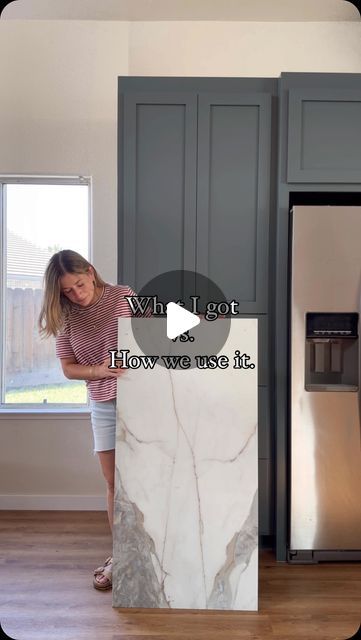 Valeria Jacobs on Instagram: "What I Got vs. How We Used It: Kitchen Reveal!  My SIL loves the look of marble, but not the maintenance or the price tag. So, when I found this gorgeous large format tile from @thetileshop, I knew it would be the perfect alternative for the backsplash. #thetileshoppartner Compared to the thousands a marble slab would cost, we spent under $600 on tile, and it perfectly completed the vision we had for this space.  The key to this project was getting a couple of extra boxes so we had enough tile to work with. We started by laying all the tiles out on the floor like a big puzzle, carefully matching the pattern as closely as possible for a seamless look. While this kitchen is full of DIYs, we decided to hire professional tile installers due to timing. However, wit Large Marble Tile Backsplash Kitchen, Kitchen Marble Tile Backsplash, Kitchen Backsplash Big Tiles, Large Tiles Backsplash, 12x24 Tile Backsplash Kitchen, Tiles Laying Pattern, Large Tile Kitchen Countertops, Kitchen Backsplash Large Tile, Large Format Tile Countertop