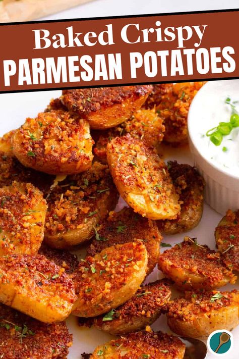 A plate of crispy parmesan potatoes topped with Italian seasoning and served with a side of dipping sauce. Crispy Spicy Potatoes, Crispy Parmesan Sweet Potatoes, Parmesan Sweet Potatoes Baked, Wings Sides, Cheesy Potato Side Dishes, Smashed Potatoes Baked, Crispy Parmesan Potatoes, Parmesan Crusted Potatoes, Easy Roasted Potatoes