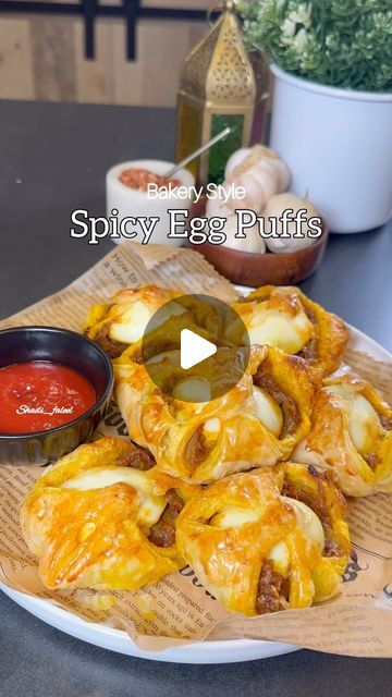 Fathima Yusuf (Shadiya) on Instagram: "Save this !! Ramadan series Episode:12  Spicy Bakery Style Egg Puffs !!  A savory delight for any time of the day & a nostalgic recipe which is has so many good memories having it fresh from the bakery every morning before leaving for school. It’s spicy slightly sweet and has everything you need in a flaky puff..   LIKE, SAVE, SHARE the reel & FOLLOW @shadi_faleel for more easy recipes.  You’ll need 5 eggs hard boiled and cut into halves  1/3 cup Oil 4 Sliced red onions  4 cloves of Chopped Garlic  1 tsp Salt or slightly more according to your taste  1 tsp Turmeric powder  1 tsp Cumin powder  1 tsp Red chilli powder  2 tsp Chilli flakes 1 tsp Kashmiri chilli powder (optional) 1 & 1/2 tbsp Sugar Juice of half a Lime Few Curry leaves (optional )  One eg Egg Puffs Recipe, Egg Puff Recipe Indian, Quick Snacks Easy Indian, Egg Puff Recipe, Egg Recipes Indian, Ramadan Series, Kashmiri Chilli, Egg Puff, Spicy Eggs