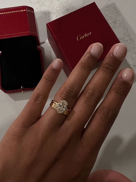 Cartier Wedding Band With Engagement Ring, Red Nails Bride Wedding, Cartier Ring With Wedding Ring, Cartier Wedding Band With Oval Ring, Ring With Cartier Band, Wedding Rings With Cartier Band, Gold Engagement Ring Aesthetic, Cartier Marriage Ring, Cartier Love Ring With Oval Engagement Ring