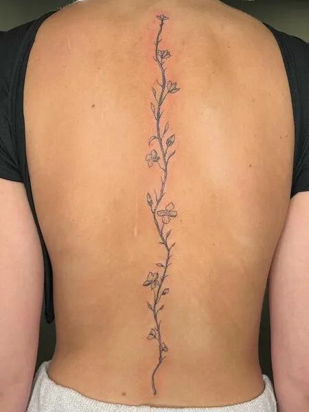 Cherry Blossom Spine Tattoo Flower Vine Tattoo Down Spine, Back Tats Women Cherry Blossom, Simply Spine Tattoo, Petite Spine Tattoos, Back Tattoo Women Simple Spine, Bodypainting, Flowers Up Spine Tattoo, Back Tattoo Women Spine Cherry Blossoms, Bottom Spine Tattoo