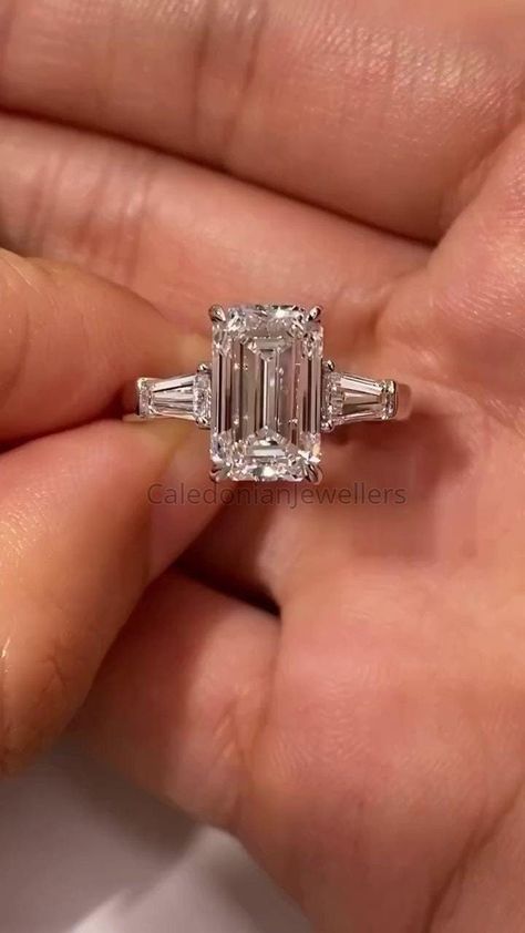 Emerald Cut Three Stone Ring, 4.0 CT Emerald Cut Colorless Moissanite Engagement Ring, Tapered Baguette Side Stone Anniversary Gift for Her. 💎𝐑𝐢𝐧𝐠 𝐂𝐞𝐧𝐭𝐞𝐫 𝐒𝐭𝐨𝐧𝐞: ✤ 𝐒𝐭𝐨𝐧𝐞 𝐓𝐲𝐩𝐞: Moissanite  ✤ 𝐒𝐭𝐨𝐧𝐞 𝐒𝐡𝐚𝐩𝐞: Emerald Cut (4 CT) ✤ 𝐒𝐭𝐨𝐧𝐞 𝐒𝐢𝐳𝐞 𝐀𝐯𝐚𝐢𝐥𝐚𝐛𝐥𝐞: 0.20CT(2*4mm), 0.50CT(3*5mm), 0.80CT(4*6mm), 1CT(5*7mm), 2CT(6*8mm), 3CT(7*9mm), 4CT(8*10mm), 5CT(9*11mm), 8CT(10*12mm), 10CT(10*14mm), 12CT(12*14mm) ✤ 𝐂𝐨𝐥𝐨𝐫: D color ✤ 𝐂𝐥𝐚𝐫𝐢𝐭𝐲: VVS1 clarity Emerald With Baguettes Engagement, Emerald Engagement Ring 3 Stone, Emerald Cut 3 Stone Ring, Baguette Side Stone Engagement Ring, Classic Winston Emerald-cut Engagement Ring With Tapered Baguette Side Stones, Emerald Cut With Tapered Baguettes, Emerald Baguette Engagement Ring, Emerald Cut Engagement Ring Thick Band, 4 Carat Emerald Engagement Ring