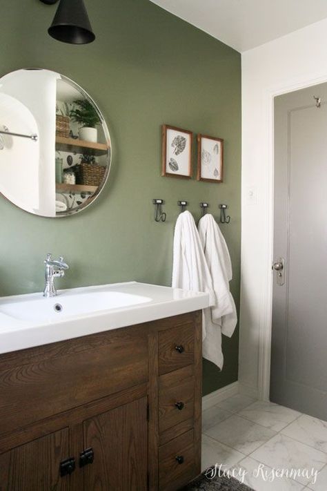 Sage Green Bathroom Mirror, Small Bathroom Green Accent Wall, Green Bathroom Dark Wood, Green Accent Wall Bathroom Ideas, All Green Bathroom Ideas, Green In Bathroom Ideas, Light Olive Bathroom, Rustic Retreat Bathroom, Bathroom Color Wall