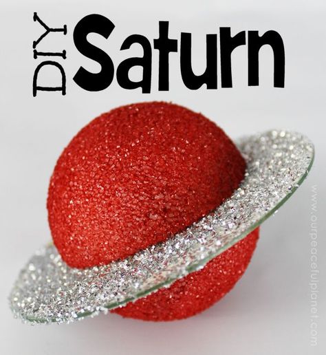 This sparkly and gorgeous Saturn is made from a foam ball and a CD. How cool is that?  If you're a fan of the cosmos you can easily see how you could make an entire universe this way! Saturn is extra cool though... due to the ring and all. It can be hung or placed on a simple wood stand as shown. Diy Saturn Planet Project, Planet Ornaments Diy, 3d Planet Project, Planet Projects For Kids, Solar System Projects For Kids, Planet Model, Planet Crafts, Planet Project, Solar System Model