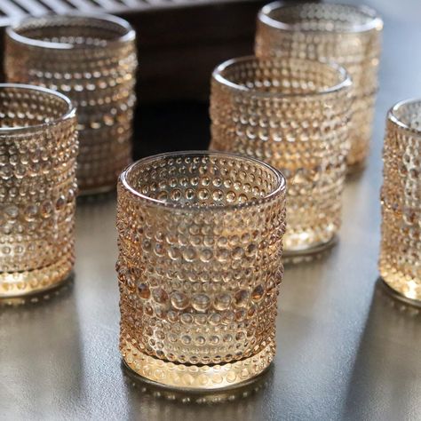 PRICES MAY VARY. 12 PCS Gold Votive Candle Holders: Elevate your ambiance with our stunning set of 12 amber candle holders. Each piece is carefully crafted to add a touch of elegance to any space Versatile Size Compatibility: Designed with dimensions of 2"D x 2.67"H, these glass tealight candle holders are made to fit most candles effortlessly. Whether you prefer votives, tealights, or small LED lights, our holders are up for the task Premium Durability and Texture: Crafted from thick and durabl Gold Mercury Votives, Amber Tea Light Holder, Gold Mercury Glass Votives, Gold Mercury Glass Candle Holders, Gold Votive Candle Holders, Holding Candle, Small Led Lights, Glass Tealight Candle Holders, Amber Candle