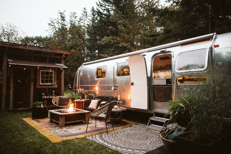 Photo 11 of 15 in A Father-Daughter Duo Lovingly Revamp a ’70s Airstream on Vancouver Island - Dwell Airstream Landscaping, Airstream Backyard, Airstream Campsite, Airstream With Deck, Airstream Glamping Site, Airstream Rental, Vintage Airstream Land Yacht, Modern Architecture Design, Metal Siding