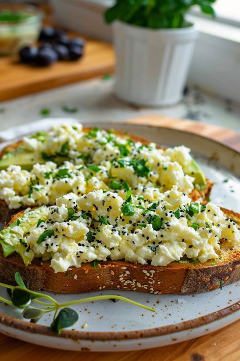 Explore the delicious pairing of cottage cheese and avocado on toast in this satisfying recipe! Perfect for breakfast, brunch, or a quick snack. Creamy cottage cheese adds protein while creamy avocado brings healthy fats. The combination creates a flavorful and nutritious toast that will keep you satisfied all morning long. Try topping it off with your favorite seasonings or fresh herbs for an extra burst of flavor. Elevate your breakfast game with this simple yet tasty dish that is sure to beco Cheese Avocado Toast, Cottage Cheese Avocado, Cottage Cheese Recipes Breakfast, Low Calorie Pancakes, Cottage Cheese Breakfast, Avocado On Toast, Avocado Recipes Breakfast, Cottage Cheese Pancakes, Avocado Toast Recipe