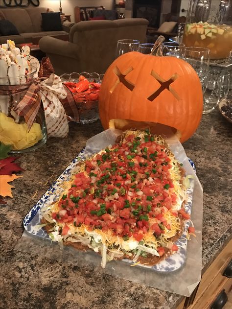 Pumpkin Puke Dip, Pumpkin With Dip Coming Out Of Mouth, Hot Food For Halloween Party, Halloween Lucky Dip, Dip For Halloween Party, Halloween Game Night Snacks, Taco Halloween Food, Jack O Lantern Charcuterie Board, Pumpkin Throwing Up Dip