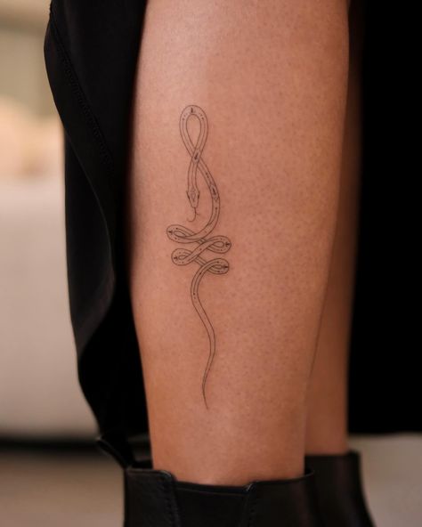 The snake in the form of an unalome combines two powerful symbols with deep spiritual and cultural meanings: 1. Unalome: The unalome symbolizes the journey to enlightenment in Buddhist tradition. The twists and turns represent the challenges, struggles, and lessons encountered on the path to spiritual growth. The straight line signifies reaching clarity and enlightenment, and the dot at the end symbolizes ultimate freedom and peace. 2. Snake: In many cultures, the snake represents transfor... Unalome Meaning, San Francisco Tattoo, Freedom And Peace, Buddhist Tattoo, Unalome Tattoo, Powerful Symbols, Buddhist Traditions, Hand Poke, The Dot