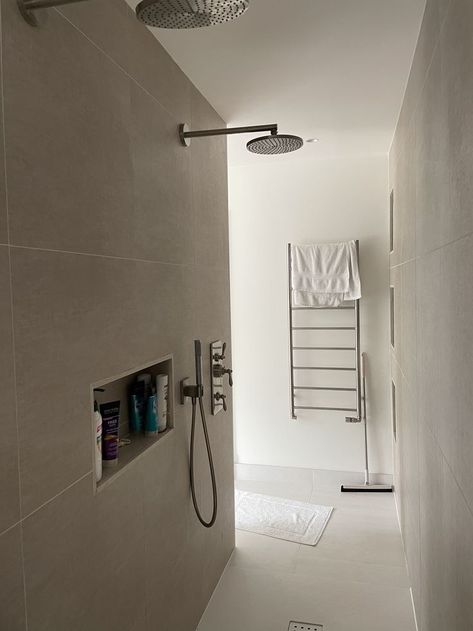 Like these adjustable angle shower heads, of simple design. Like the cubby hole in the wall for shampoo etc. Like the handheld shower in addition to the overhead. Like the heated towel rail. Simple. Cubby Hole, Hole In The Wall, Heated Towel Rail, Heated Towel, Bathtub Shower, Hand Held Shower, Towel Rail, Cubbies, House Stuff