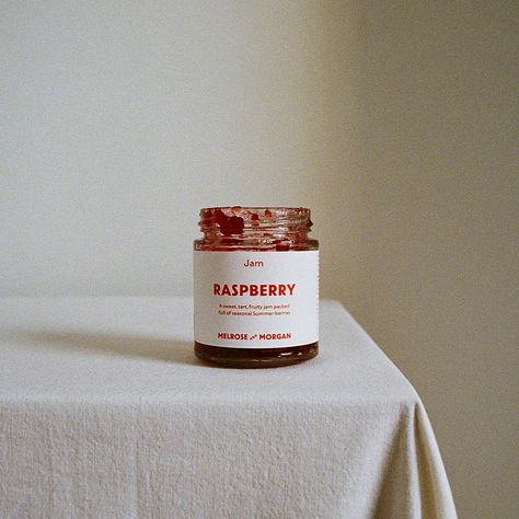 an open jar of Melrose and Morgan raspberry jam Raspberry Jam Aesthetic, Food Package Photography, Jam Product Photography, Jam Photography, Jamming Aesthetic, Jam Aesthetic, Product Lifestyle Photography, Photography Art Direction, 35mm Photography