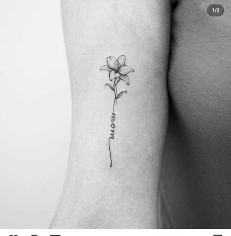 Lily Tattoo With Name As Stem, Lily And Name Tattoo, Lily Flower Name Tattoo, Flower Stem With Name Tattoo, Fine Line Flower Name Tattoo, Lily Flower With Name Tattoo, Flower Tattoo With Stem Writing, Flower Tattoo With Words As Stem Arm, Small Lilies Tattoo