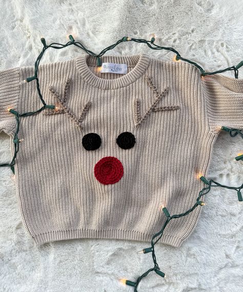 Hand Embroidered Holiday/Reindeer Sweater. One of our most popular holiday designs: the reindeer sweater!  MATERIALS/FIT: These sweaters have an oversized fit/feel and are a knit material, so they do have a stretch to them. They are 100% cotton. See approximate measurements below:  Size/Length/Chest      * 0-3 M / 11 in / 12 in     * 3-6 M / 11.5 in / 13 in     * 6-9 M / 12 in / 13.75 in     * 9-12 M / 13 in / 14.5 in     * 12-18 M / 14.25 in / 15.5 in     * 2T / 15.5 in / 16 in     * 3T / 16.5 Embroidered Name Sweater, Kids Christmas Sweater, Hand Embroidered Sweater, Embroidered Sweaters, Name Sweater, Holidays With Toddlers, Kids Christmas Sweaters, Reindeer Sweater, Animal Sweater