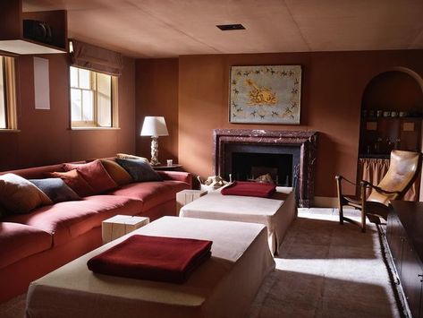 Rose Uniacke on Instagram: "A cosy lower ground cinema room fully upholstered, walls and ceiling, in Rose Uniacke Cotton Velvet in ‘Cobnut’.   An 18th century piedmontese original fire screen hangs over the fire, alongside a beautifully long custom-made Rose Uniacke sofa covered in RU Wool ‘Spice’.  #RoseUniacke #RoseUniackeInteriors" Rose Uniacke Interiors, Rose Uniacke Home, Rose Uniacke Staircase, Rose Uniacke Pimlico House, Red Marble Fireplace, Rose Uniacke Fabric, Rose Uniacke Studio Sofa, Loft Vibes, Vintage Scandinavian Furniture