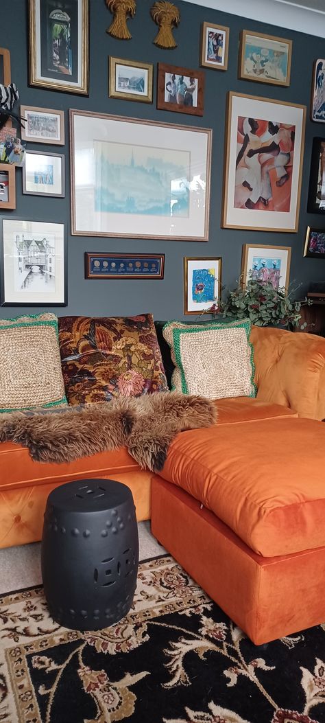 Orange sofa and footstool with #farrowandball downpipe paint. Orange And Navy Living Room, Dark Study, Bright Sofa, Navy Accent Walls, Bold Living Room, Vaulted Ceiling Living Room, Navy Living Rooms, Orange Sofa, Moody Decor