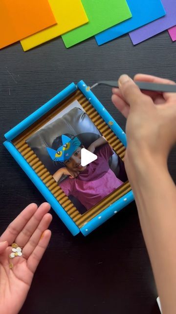 CraftISH corner on Instagram: "DIY Picture Frame Idea for Kids! 🖼️ 

Looking for a cool summer project before school starts? This DIY picture frame is perfect! It’s a great way to create memories and could be a fantastic desktop decor for anyone in the family.✨

Follow for more @craftishcorner 

Youtube link in bio ⬆️ 
.
.
.
.
.
#diyframe #diypictureframe #diyphotoframe #cardboard #cardboardframe #cardboardcrafts #papercrafts #paperdecor #homedecorideas #deskdecor #tabledecor #tabledecorideas #tabletopframe #wallframediy #walldecorideas #photodiy #pictureframeidea #desktopdecor #deskdecordiy #deskdecor #deskdecorideas" Easy Diy Photo Frames, Diy Frame Ideas, Wall Frames Diy, Cardboard Picture Frames, Kids Art Space, Diy Picture Frame, Photo Frame Crafts, Before School Starts, Family Frame