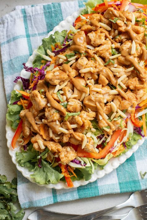 Thai-inspired Chicken Salad with Peanut Sauce on a white platter. Mandarin Chicken Salad, Thai Chicken Salad With Noodles, Asian Chicken Salad With Peanut Dressing, Thai Peanut Chicken Crunch Slaw Salad, Health Nut Chinese Chicken Salad, Thai Chicken Salad With Peanut Dressing Rice Noodles, Thai Salad Recipes, Avocado Chicken Salad Recipe, Thai Chicken Salad