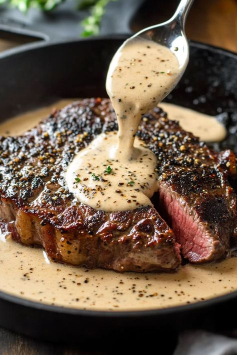 Savor a perfectly seared Bavette steak cooked in a cast iron skillet, topped with a rich whiskey garlic cream sauce for an indulgent, meal. Cast Iron Bavette Steak With Whiskey Garlic Cream Sauce, Babette Steak With Whiskey Garlic Cream Sauce, Cast Iron Steak Recipes Ovens, Whiskey Garlic Cream Sauce, Steak With Ghostly Bourbon Garlic Cream Sauce, Haunted Bourbon Garlic Cream Sauce, Steak With Haunted Bourbon Cream Sauce, Seared Steak Cast Iron, Whiskey Steak Sauce