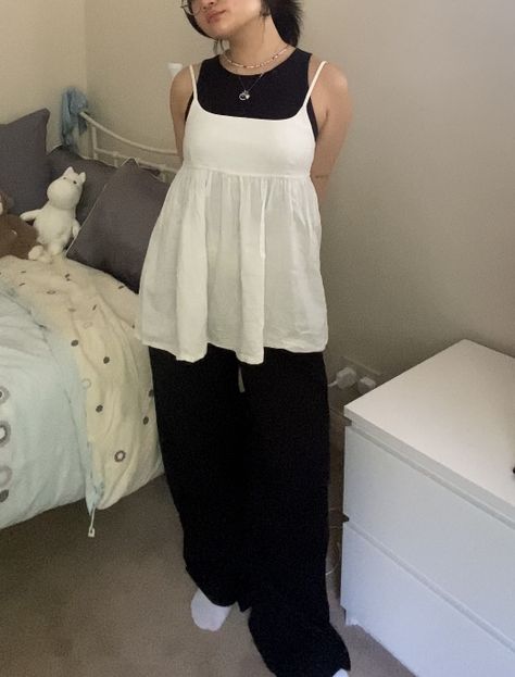 Black tank top and black wide leg formal trousers layered on top with a white baby doll top spring autumn summer outfit Doll Top Outfit, Babydoll Tank Top Outfit, Baby Doll Top Outfit, Black Tank Outfit, Babydoll Tank Top, Baby Doll Top, Tank Outfit, Babydoll Tank, Formal Trousers