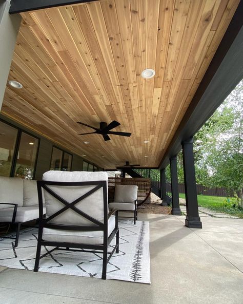 Waterproof Deck Ceiling, Gabled Porch Roof, Outdoor Patio Cedar Ceiling, Dark Gray House With Wood Accents, Wood Ceiling Patio, Tongue And Groove Ceiling Porch, Painted Porch Ceiling, Cedar Porch Ceiling, Front Porch Flooring