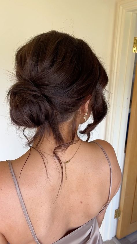 Lose Hair Updos, Low Bun Hairstyles For Bridesmaids, Fancy Bun Updo, Bridesmaid Hair Bun Messy, Low Messy Formal Bun, Prom Hair Updo Bun, Bun Hairstyle Formal, Messy Bun Bridesmaid Hair, Low Messy Bun Wedding Hair Brunette