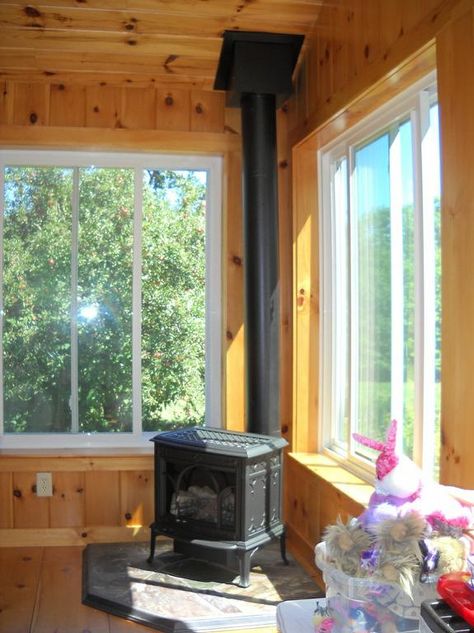 Love this fireplace Three Season Porch With Wood Stove, 4 Season Porch With Wood Stove, Patio Doors To Sunroom, Enclosed Porch With Wood Stove, Wood Stove In Sunroom, Sunroom Wood Stove, Sunroom With Wood Burning Stove, 3 Season Room With Wood Stove, Sunroom With Wood Stove