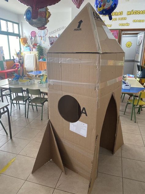 Rocket Ship Diy Cardboard Boxes, Rocket Ship Craft Cardboard Boxes, Rocket Activities For Kids, Diy Space Station, Planet Decorations, Cardboard Rocket Ship, Cardboard Spaceship, Cardboard Rocket, Space Theme Classroom