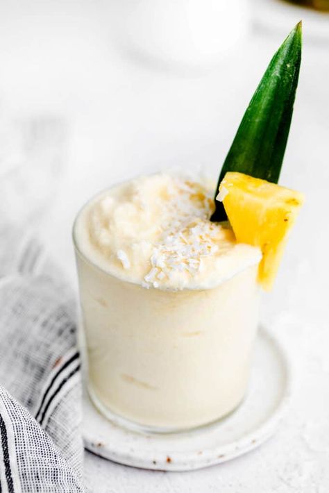 Learn How to make Piña Colada with frozen fruit, white rum, and coconut milk. This piña colada recipe is so refreshing and tastes like a pineapple coconut frozen delight! Best Pina Colada Recipe, Dole Whip Smoothie, Frozen Pina Colada Recipe, Boat Cocktails, Pina Colada Frozen, Virgin Pina Colada Recipe, Pina Coloda, Pina Colada Drink, Piña Colada Recipe